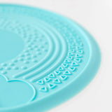 Close-up of Bumkins Silicone Sensory Placemat: Blue on a white background, showcasing the textured design.