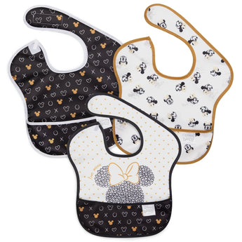 Bumkins SuperBib® 3 Pack: Love, Minnie includes 3 waterproof bibs with Minnie Mouse designs in black, white, and gold.