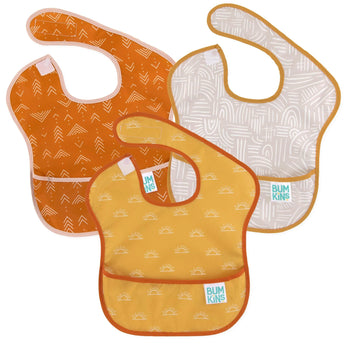 Bumkins SuperBib® 3 Pack: Desert Boho includes three bibs with colorful abstract patterns made of waterproof fabric, with a front pocket.