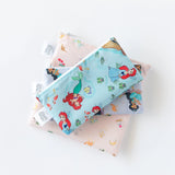 Bumkins Reusable Snack Bag, 3-Pack: Princess Magic, Ariel, and Jasmine lays stacked on a white background.
