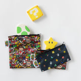 Bumkins Reusable Snack Bag, 3-Pack: Super Mario™ Power Up lays on a white background with video game icon shaped cookies.