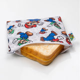 Bumkins Reusable Snack Bag, Large: Super Mario™ & Luigi holds a grilled cheese sandwich on a white background.