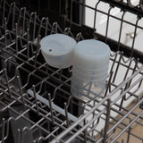 Bumkins Silicone Straw Cup with Lid: Gray sits in the top rack of an open dishwasher.