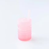 Bumkins Silicone Straw Cup with Lid: Pink sits on a white background.