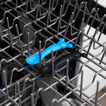 Bumkins Silicone Dipping Spoons: Mickey Mouse (Black and Blue) sit in the top rack of an open dishwasher.