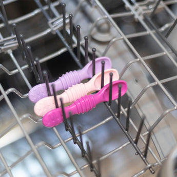 Bumkins Silicone Dipping Spoons 3 Pack: Lollipop sits in the top rack of an open dishwasher.