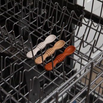 Bumkins Silicone Dipping Spoons 3 Pack: Rocky Road sits in the top rack of an open dishwasher.