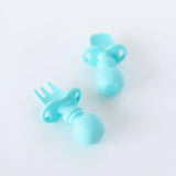 Bumkins Silicone Chewtensils®: Blue rest on a white background.