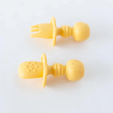 Bumkins Silicone Chewtensils®: Pineapple lay face-down on a white background, showcasing sensory bumps on the back.