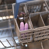 Bumkins Spoon + Fork: Lavender sits in the utensil compartment of an open dishwasher.