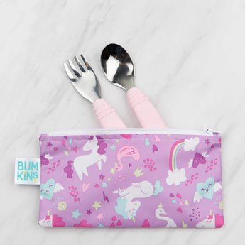 Bumkins Spoon + Fork: Pink peeks from a purple unicorn-patterned pouch on a marble background.