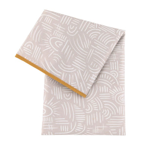 Bumkins Splat Mat: Wander is a beige, waterproof, machine washable mat with abstract white patterns and an orange trim.