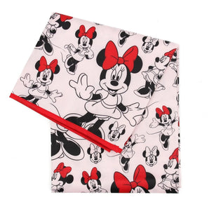 Bumkins Splat Mat: Minnie Mouse is made of pink waterproof fabric with a Minnie Mouse design and red trim.