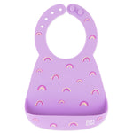 Bumkins Silicone Bib: Rainbows features a purple silicone bib with rainbow patterns, a pocket, and adjustable neck closure.