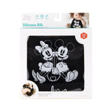 Bumkins Silicone Bib: Mickey + Minnie Mouse is shown in a white packaging box with a clear front window displaying the bib.