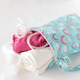 Bumkins Wet Bag: Rainbows stores cloth diapers, breast pump parts, and a towel on a white background.