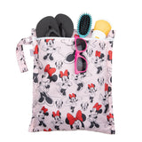 Bumkins Wet Bag: Minnie Mouse Classic holds sunglasses, sunscreen, sandals, and a hairbrush on a white background.