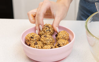 Finished no-bake lactation bites arranged in Bumkins silicone grip bowl, ready to eat.
