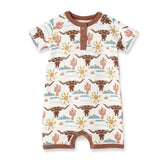 Tesa Babes Bamboo Romper, Happy Trails: white with brown longhorns, yellow suns, pink cacti; brown trim & buttons. Perfect for a cowboy!.
