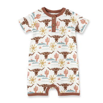 Tesa Babes Bamboo Romper, Happy Trails: white with brown longhorns, yellow suns, pink cacti; brown trim & buttons. Perfect for a cowboy!.