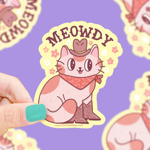 Turtle Soups Meowdy vinyl sticker: Cowboy Cat in a hat & boots with MEOWDY text on purple, scratch-resistant.