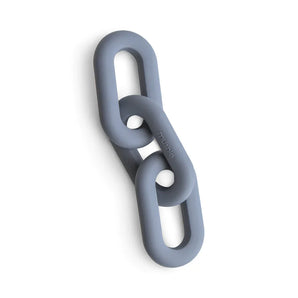 The Links Teether by Mushie features three interlinked oval gray links made of food-grade silicone, ideal for teething.