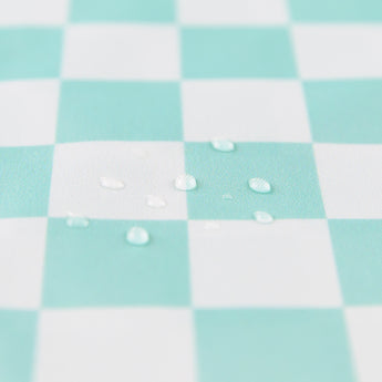 Close-up of water droplets on a Bumkins Wet Bag Plus 2 Pack: Mint + Charcoal Check.