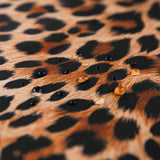 Close-up of water droplets on Roamio by Bumkins Wet/Dry Clutch: Leopard.