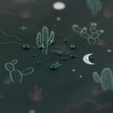 Close-up of water droplets on a Roamio by Bumkins Reusable Snack Bag 4 Pack: Desert Night.