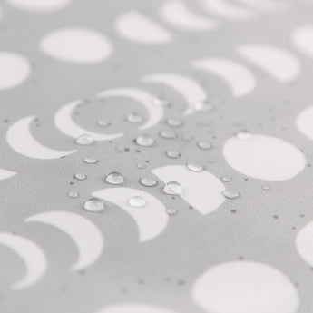 Close-up of water droplets on Bumkins Wet/Dry Bag: Lunar Phase.