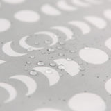 Close-up of water droplets on a Bumkins The Playdate Planner Deluxe 5-Piece Set: Lunar Phase.