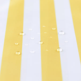 Close-up of water droplets on a Bumkins Wet Bag Plus 2 Pack: Blue + Yellow Stripe.