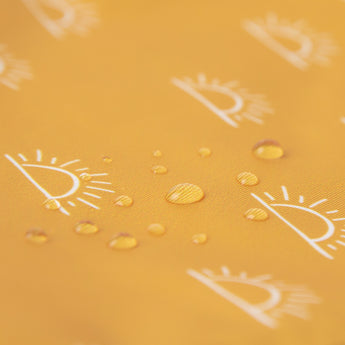 Close-up of water droplets on a Bumkins Wet Bag 2 Pack: Wander and Sunshine.