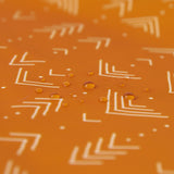 Close-up of water droplets on Bumkins Long-Sleeved Art Smock: Grounded.
