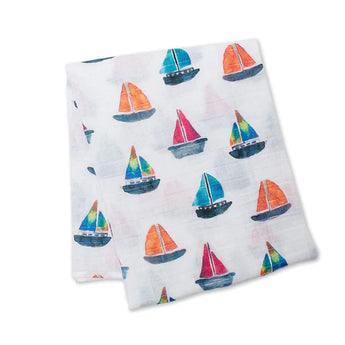 Lulujo Inc.s Cotton Swaddle, Sailboats: White fabric with red, blue, and green sailboat patterns ideal for swaddles or baby blankets.