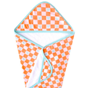 The Hooded Towel, Mickey Mouse Check by copp is an orange and white checkered towel with blue Mickey Mouse silhouettes and trim.