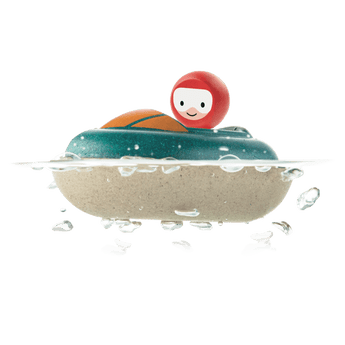 The Wooden Speed Boat Bath Toy by PlanToys floats and splashes, featuring a smiling red figurine.