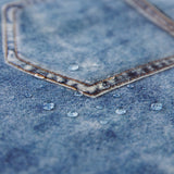 Close-up of water droplets on a Roamio by Bumkins The Commuter Deluxe 5-Piece Set: Denim On Denim.
