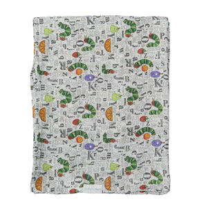 A LouLou Lollipop muslin swaddle with caterpillars, letters, and fruits on white, inspired by The Very Hungry Caterpillar.