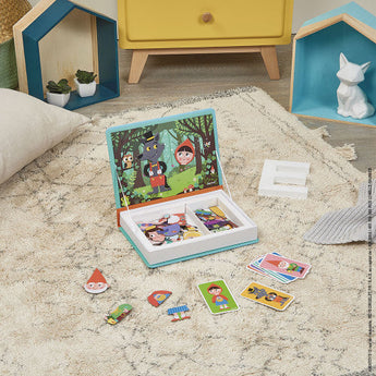 The playroom features Janod Juratoys Magnetic Book, Fairy Tales. Colorful pieces on a beige rug to enhance fine motor skills.