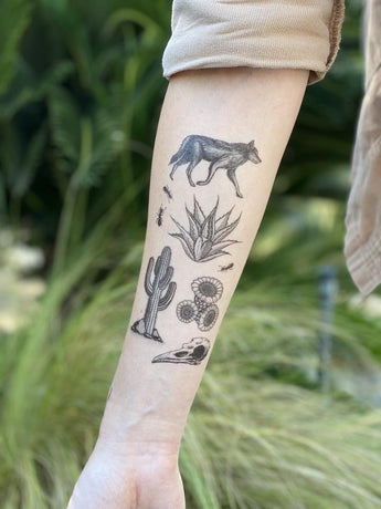 NatureTats Desert Wild tattoo captures the allure of the American Southwest with a wolf, agave, cactus, and bird skull.