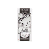 Lulujo Inc.s Bamboo Swaddle with a black floral design is packaged in a windowed box.