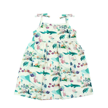 Emerson and Friends Sundress, Coral Reef: sleeveless white girls’ dress with colorful fish, sharks, and shoulder ties.