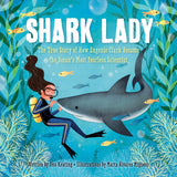 The Shark Lady hardcover by Sourcebooks shows Eugenie Clark in scuba gear swimming with sharks, fish, and sea plants.