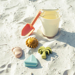 Emerson and Friends Beach Bucket Toy Play Set: Silicone bucket, orange shovel, sun, foot, palm tree & sailboat sea-themed toys.