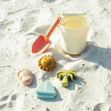 Emerson and Friends Beach Bucket Toy Play Set: Silicone bucket, orange shovel, sun, foot, palm tree & sailboat sea-themed toys.