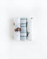 Little Unicorns Cotton Swaddle Set includes three blankets with bison, geometric patterns, and turtle prints on a white background.