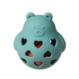 Roly Rattle by Mary Meyer: A blue bear-shaped teether with heart holes, made from food-safe silicone showing a red layer inside.