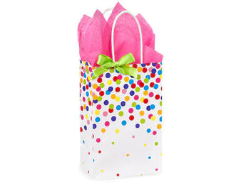 Gift wrapping by Zoolikins | Childrens Boutique features multicolored dots, a green bow, and pink tissue paper—ideal for cheerful cards.