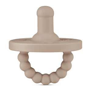 The Ryan & Rose Cutie PAT, a medical-grade silicone round pacifier and teether in Dune, features a beaded ring handle.